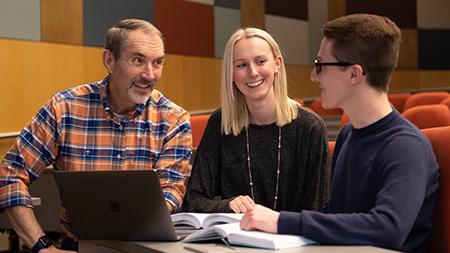 Dr. Miller talking with Bible Students